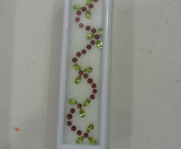 Garnets and peridot, for bracelets.